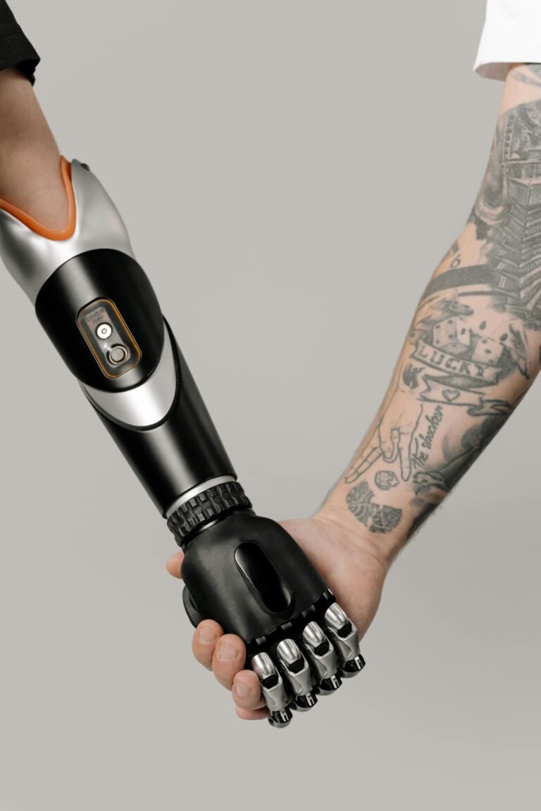 A cybernetic prosthetic arm shakes hands with a tattooed arm, symbolizing unity.